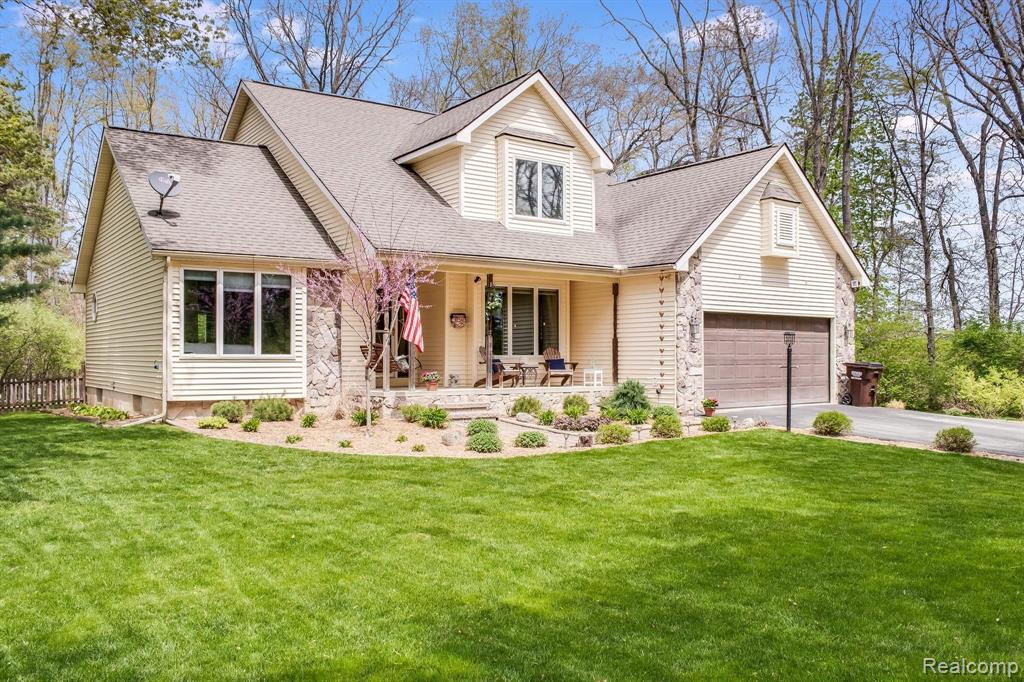 Beautiful home exterior with blooming tree